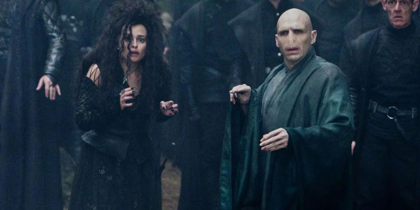 Ralph Fiennes as Lord Voldemort and Helena Bonham Carter as Bellatrix, standing next to each other among the Death Eaters, in Harry Potter