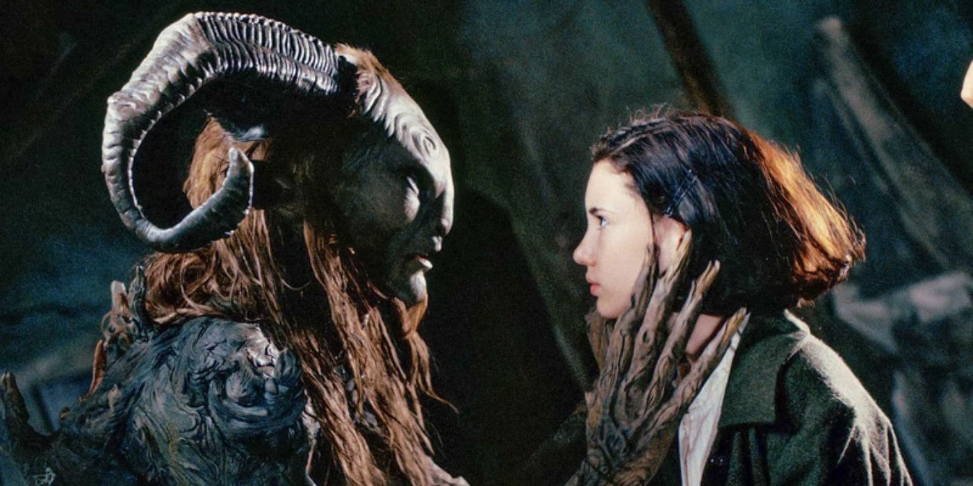 Doug Jones in heavy make-up as Fauno, wrapping his branch-like hand around Ivana Baquero's neck, in Pan's Labyrinth