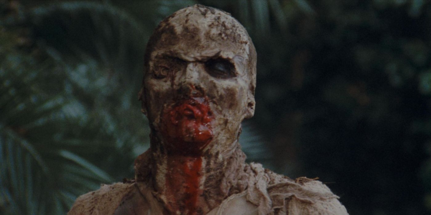 A medium close-up of a zombie with blood running down its mouth