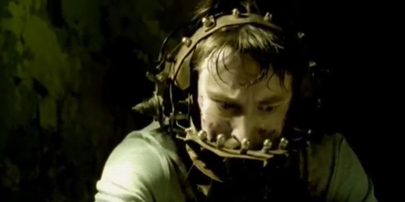 A man with his head in a torture contraption in the Saw short film