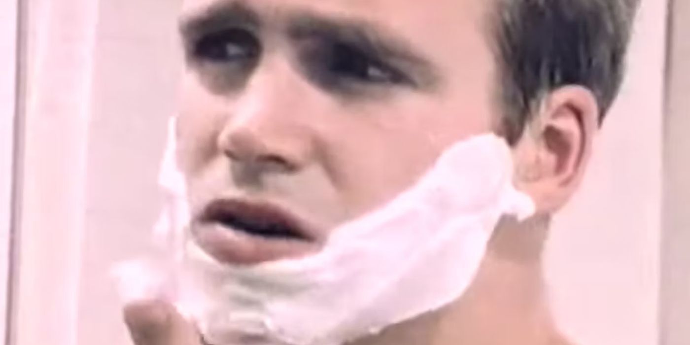 A man applies shaving cream to his face in The Big Shave (1967)