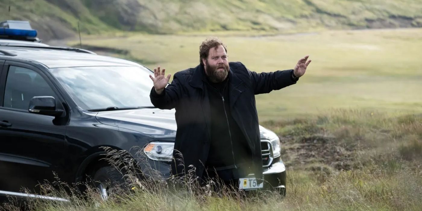 Ólafur Darri Ólafsson with his hands in the air in Trapped