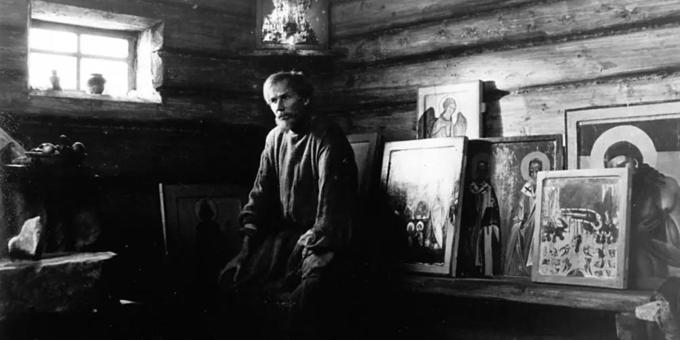 Andrei Rublev sits in his studio, surrounded by his artwork 