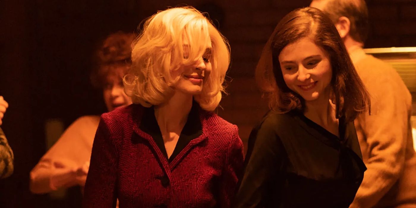 Anne Hathaway as Rebecca and Thomasin McKenzie as Eileen Dunlop in Eileen (2023).