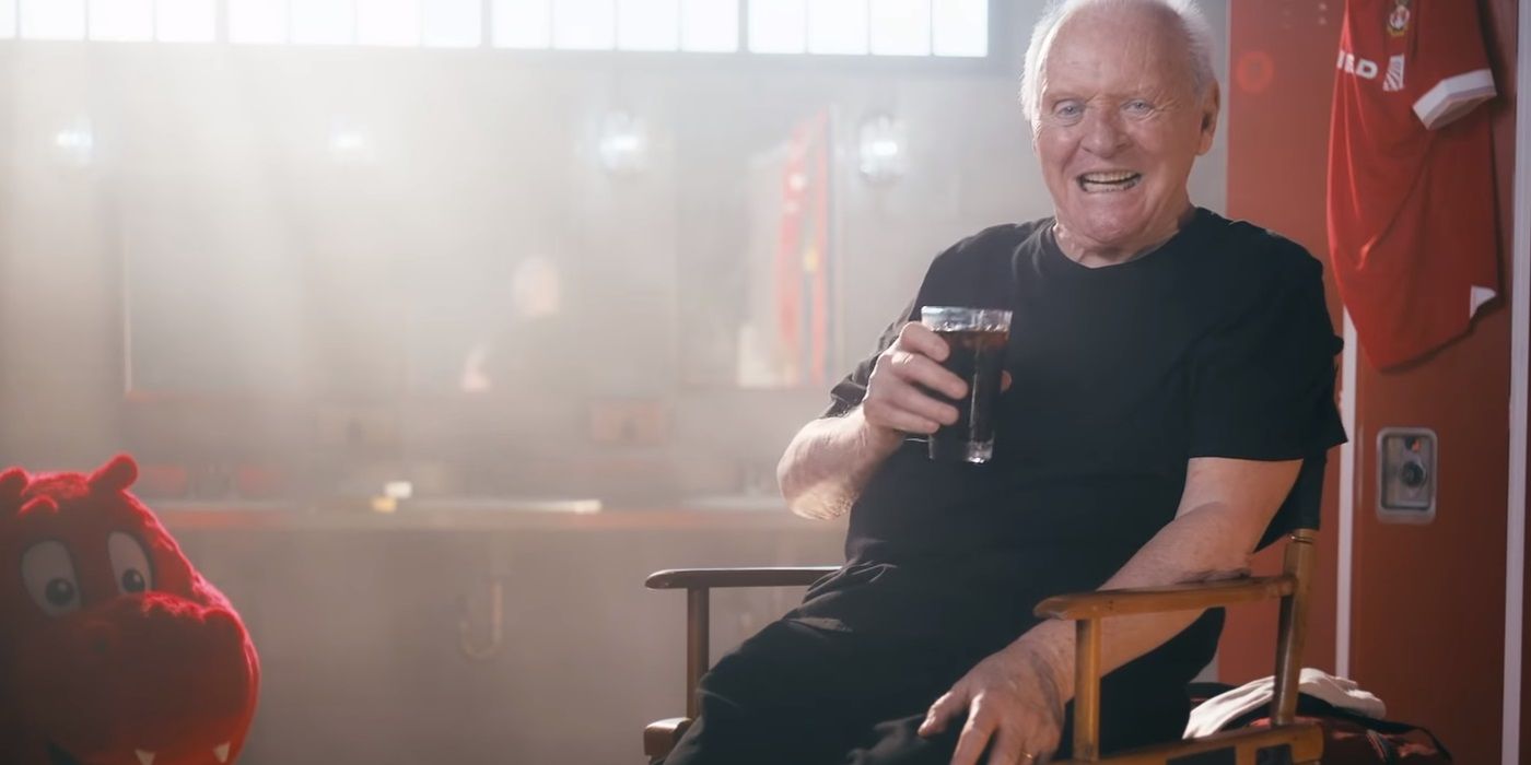 Anthony Hopkins with a cold brew coffee in a locker room
