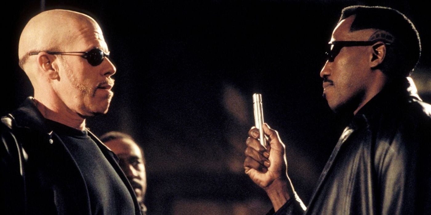 wesley snipes and ron perlman face each other while snipes holds a metal stick in the film blade II