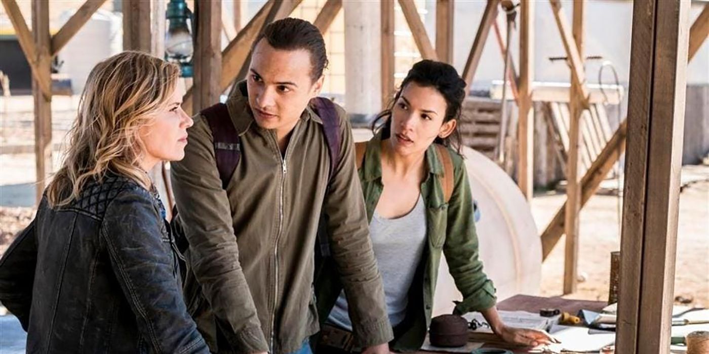 Madison, Nick, and Luciana standing together by a table in a scene from Fear the Walking Dead.