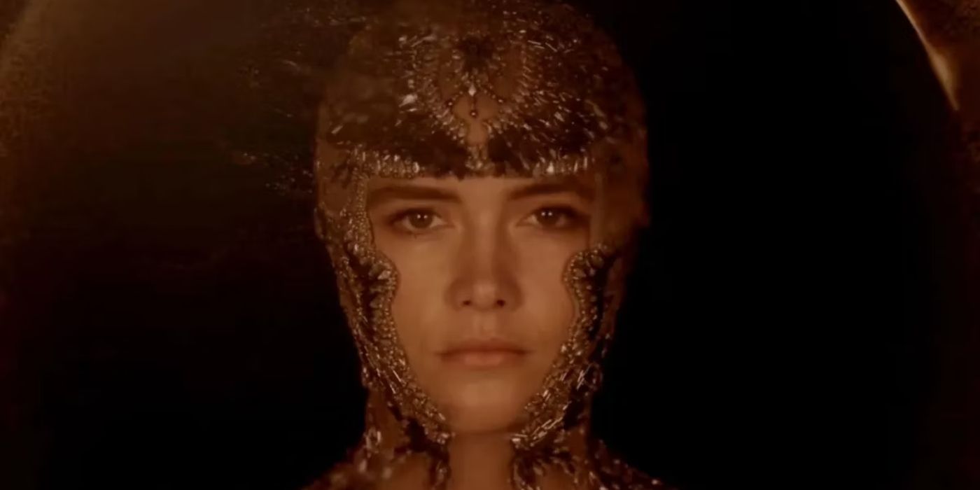 Florence Pugh as Princess Irulan wearing a face cover made of jewels in Dune Part Two