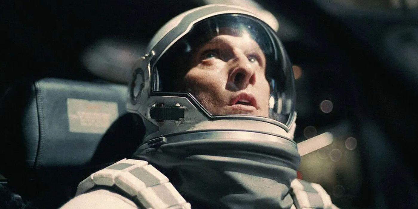 Matthew McConaughey in Interstellar wearing a space suit and looking up