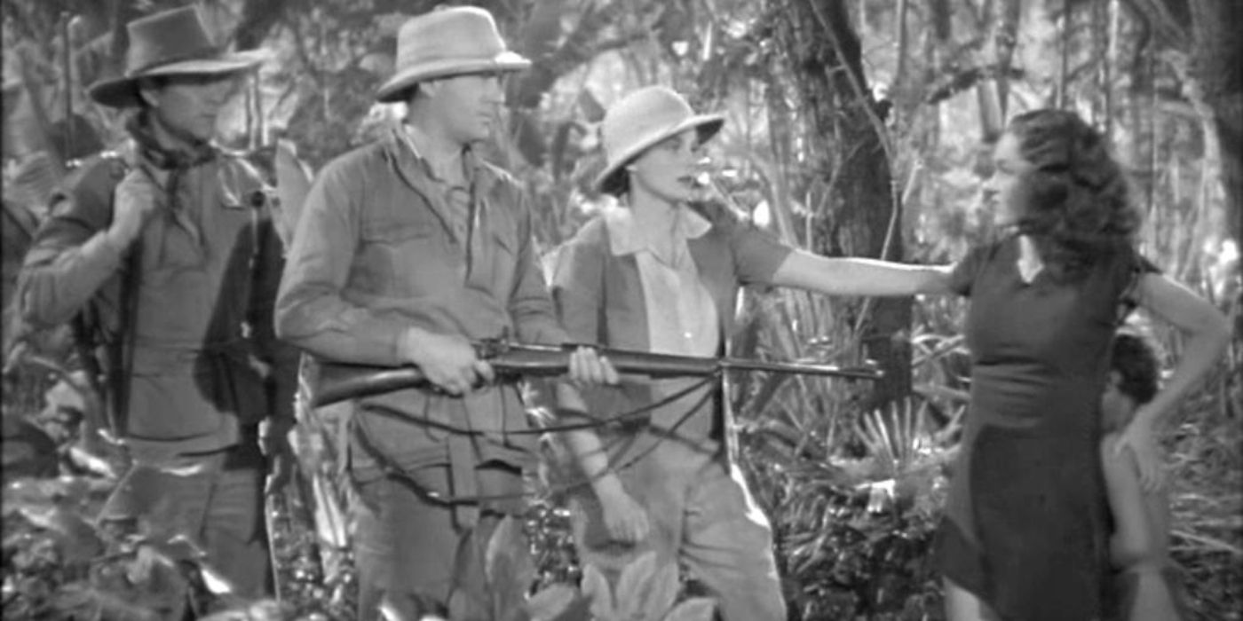 Jane protegendo menino de caçadores furtivos em Tarzan encontra um filho