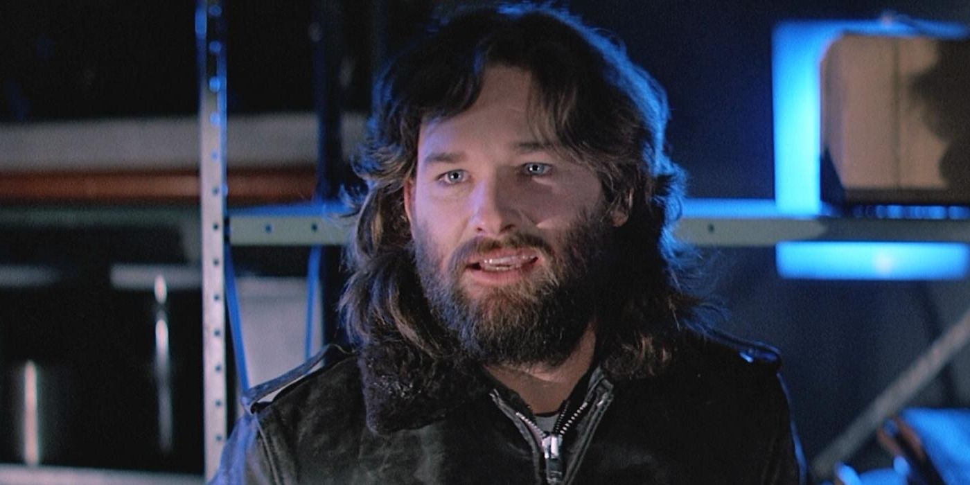 Kurt Russell as MacReady looking off-camera in The Thing (1982)