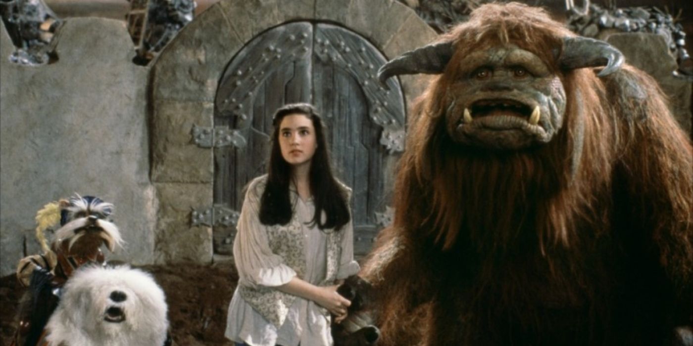 Jennifer connelly stands beside strange creatures in the film labyrinth