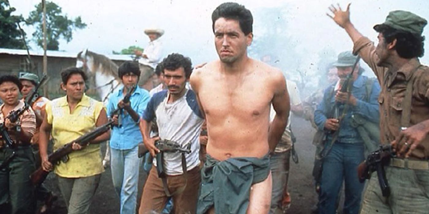 A shirtless Robert Beltran as Eddie Guerrero being arrested by a a mob of men with guns