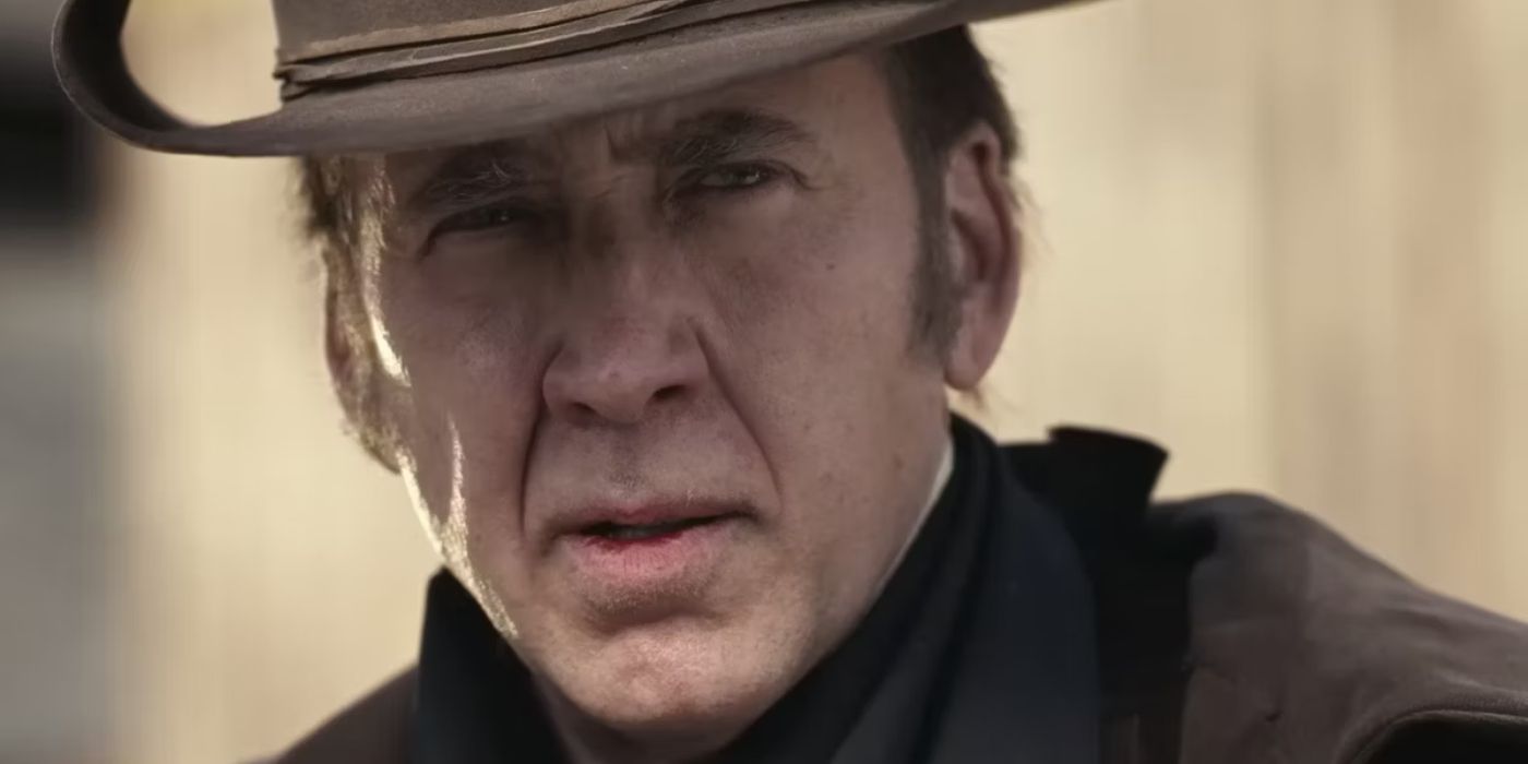 Nicolas Cage as Colton Briggs squinting at the camera in The Old Way