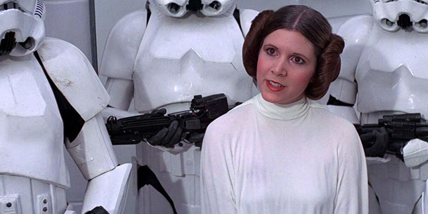Carrie Fisher as Princess Leia, flanked by Stormtroopers in A New Hope