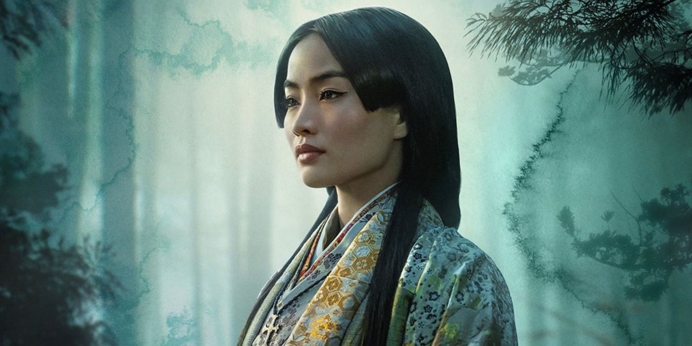 Anna Sawai as Lady Mariko wearing robes and a Christian necklace standing in the forest in Shogun