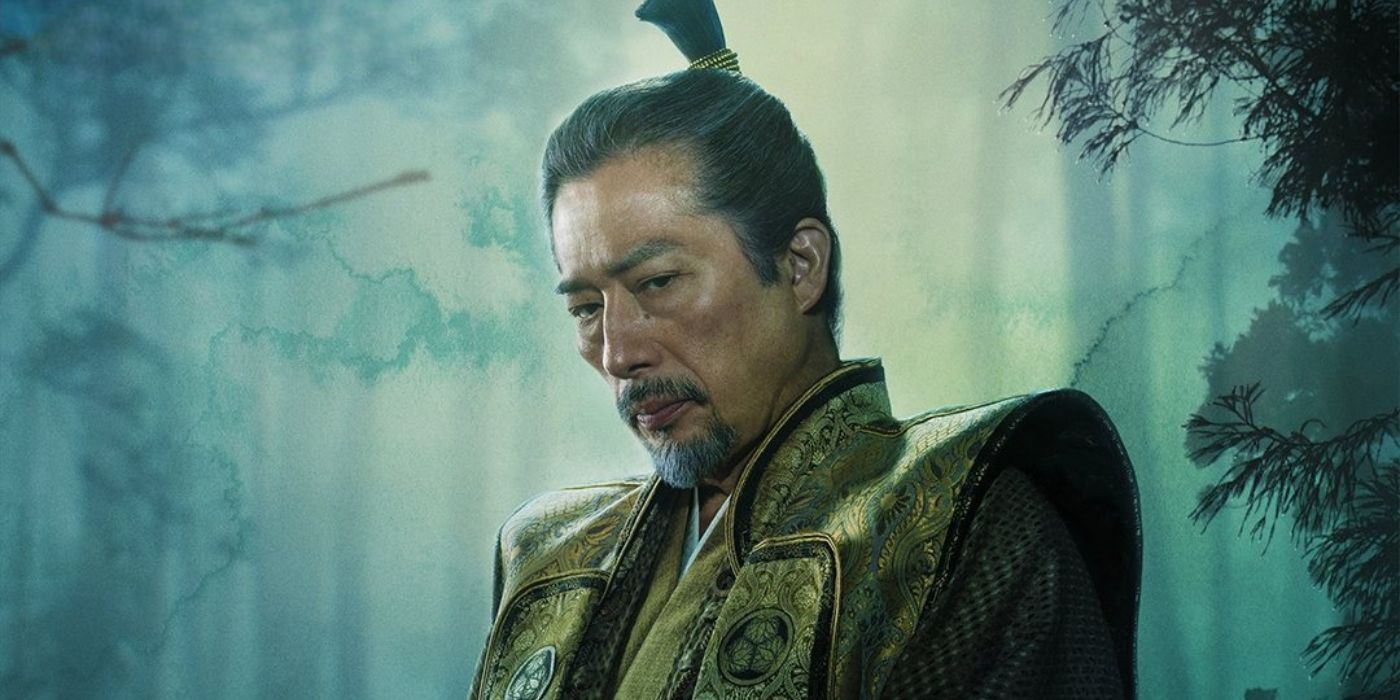 Hiroyuki Sanada as Lord Yoshi Toranag wearing elegant clothing standing in a forest in Shogun