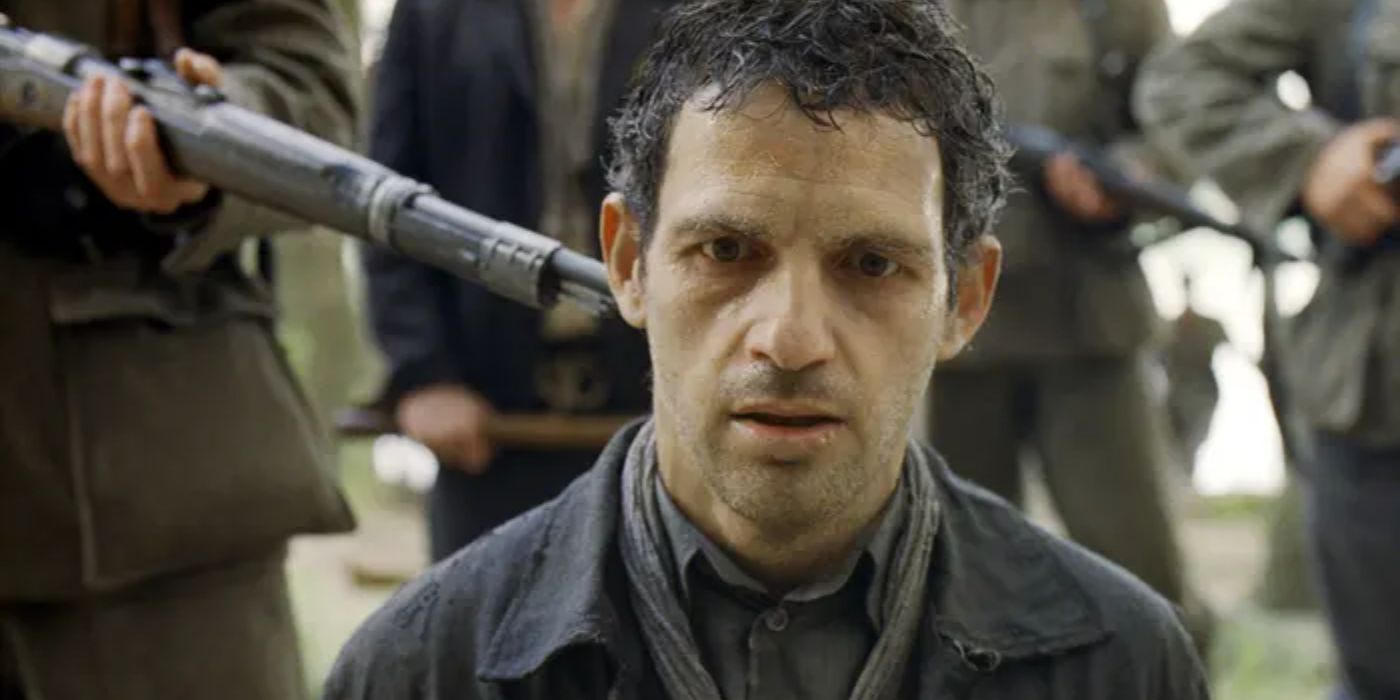 Géza Röhrig with a gun to his head in Son of Saul (2015)