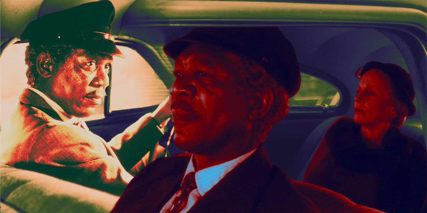 Jessica Tandy as Daisy sitting in the back of a car with Morgan Freeman as Hoke in the driver's seat in Driving Miss Daisy