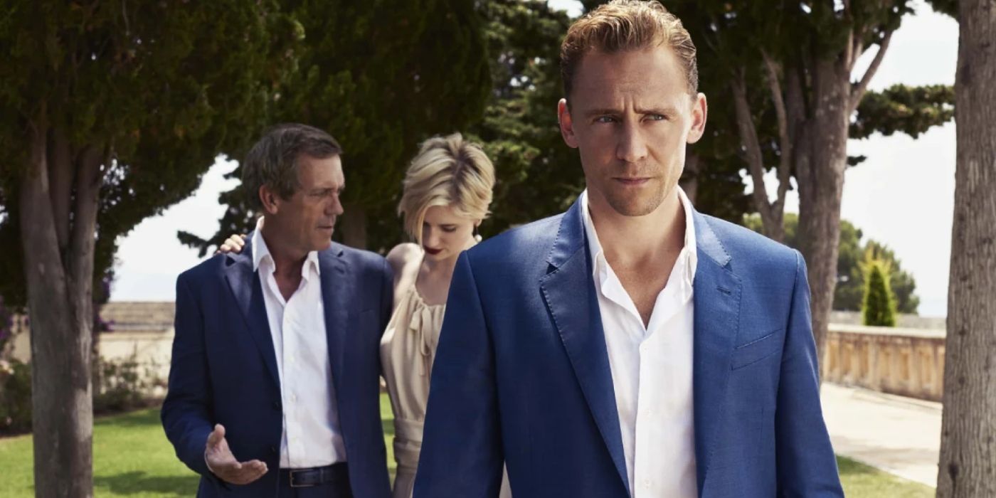 tom hiddleston walks in front of hugh laurie and elizabeth debicki n in the show the night manager