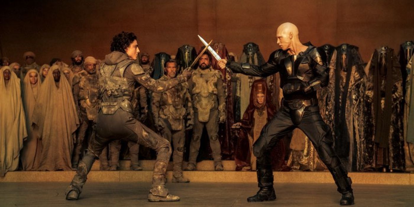 Timothée Chalamet as Paul Atreides & Austin Butler as Feyd-Rautha Harkonnin in a blade fight in Dune: Part Two