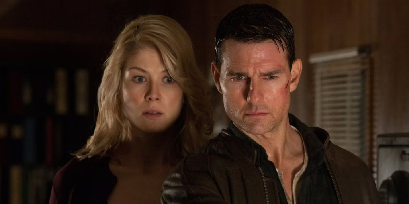 Tom Cruise and Rosamund Pike looking startled in Jack Reacher Never Go Back