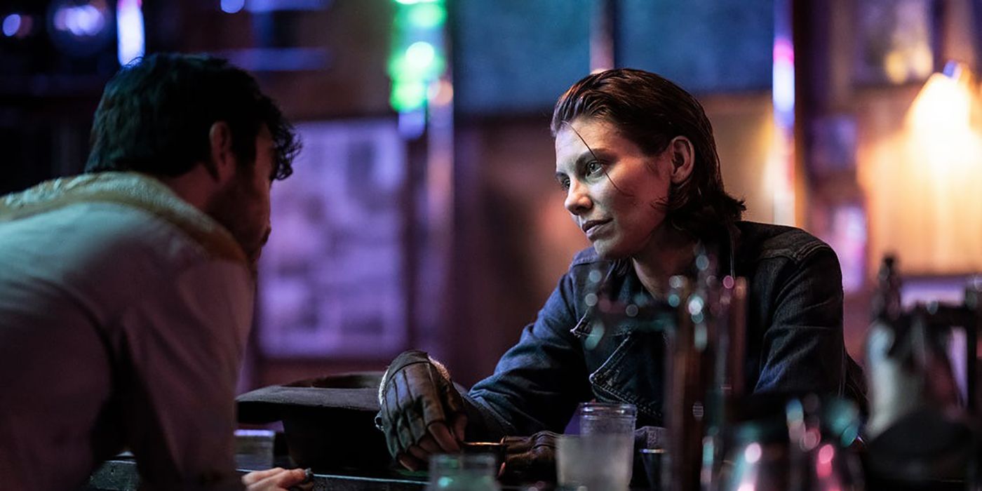 Maggie with slicked back hair sitting in a bar talking to the bartender in The Walking Dead: Dead City.