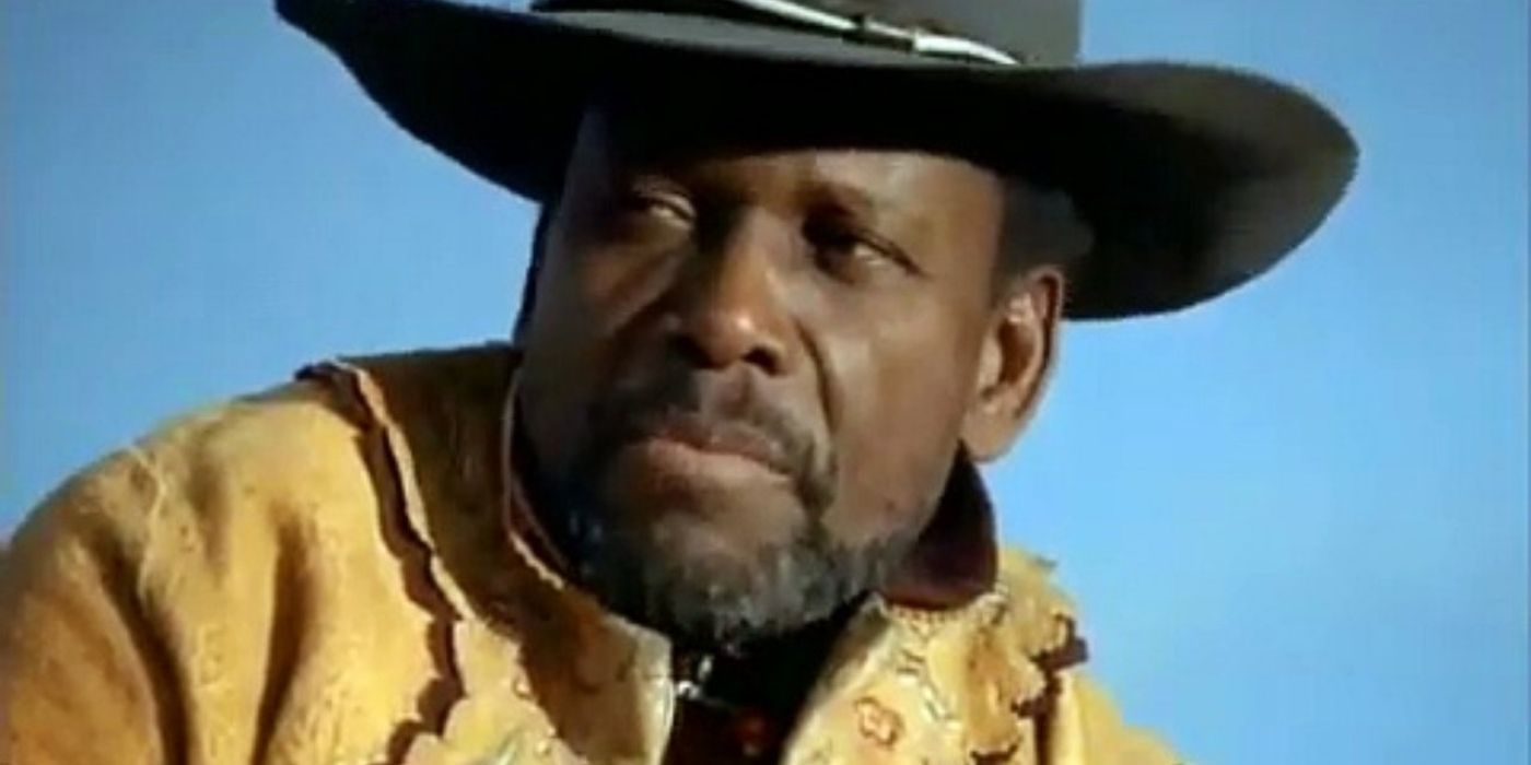 A man wears a cowboy hat in Children of the Dust