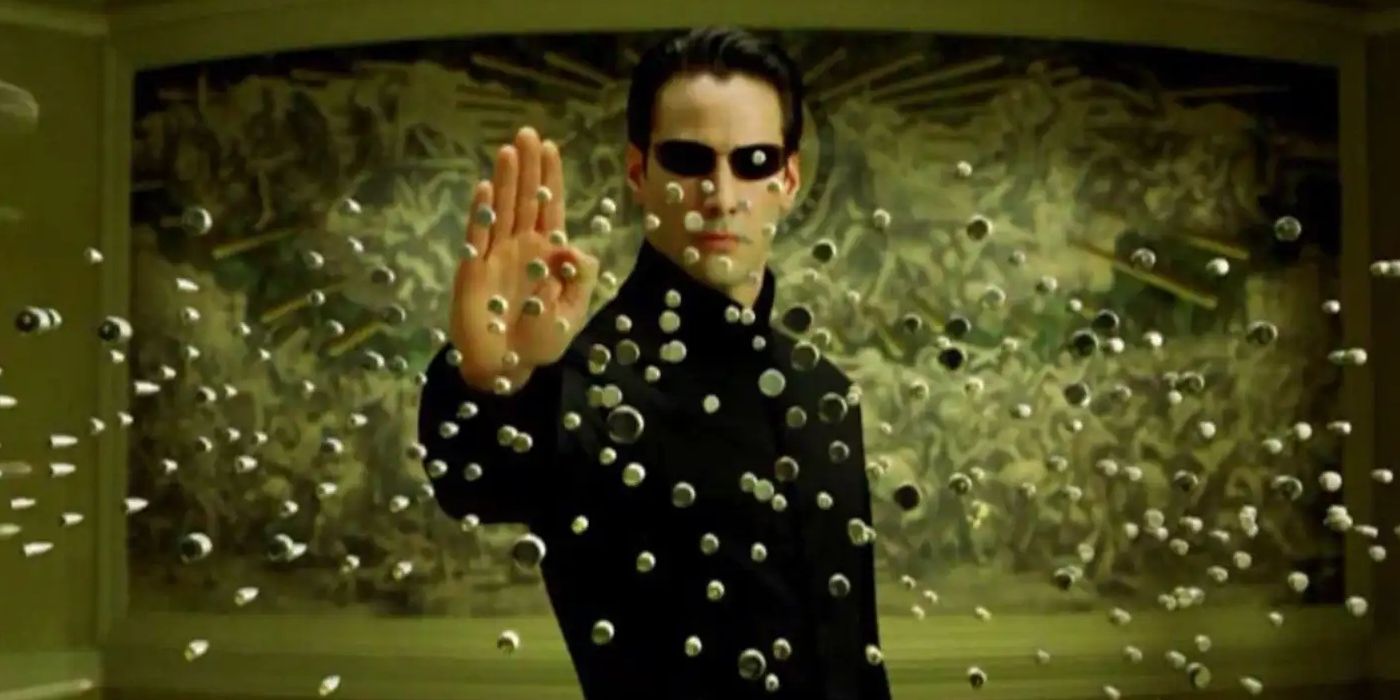 Keanu Reeves as Neo in the famous visual effects shot of Neo stopping bullets in The Matrix