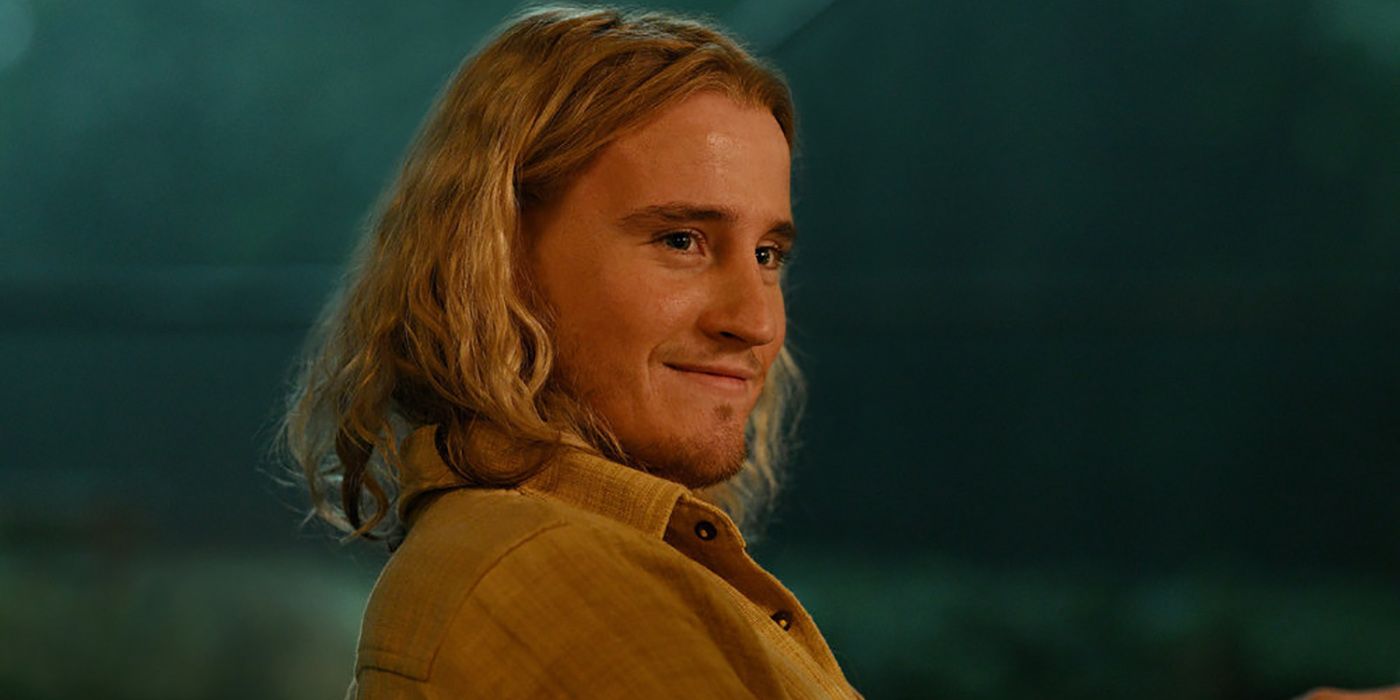 Conor Merrigan Turner, as Logan, smiles slyly in a scene from Apples Never Fall