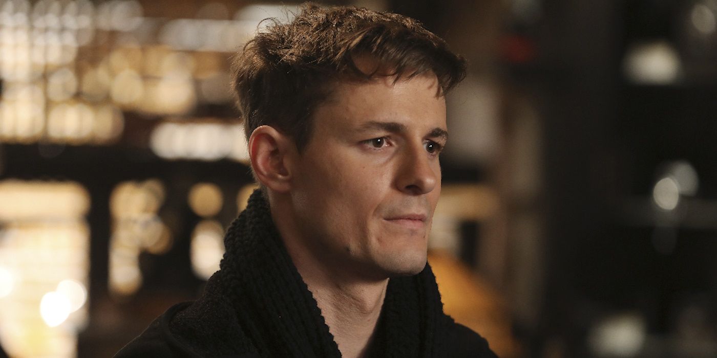 Giles Matthey stares at something offscreen in ABC's Once Upon a Time