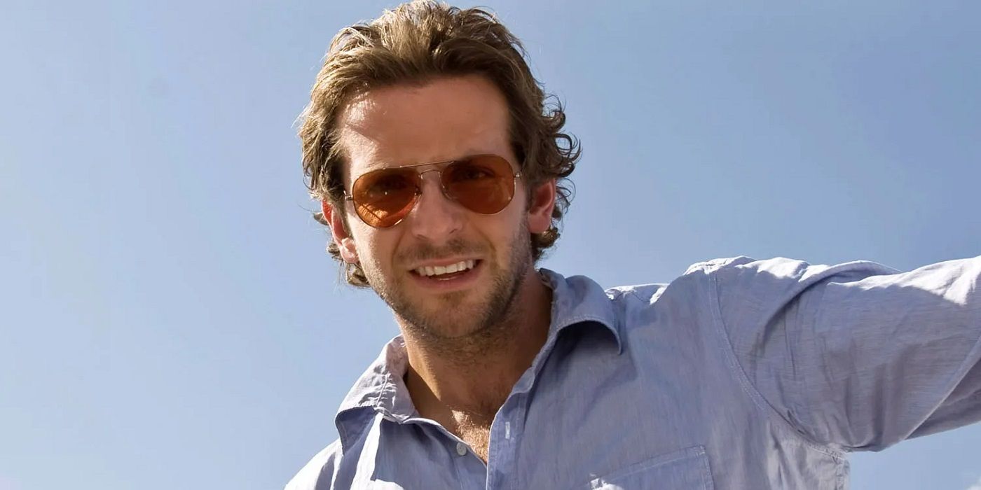 Bradley Cooper wearing sunglasses and a blue shirt in The Hangover
