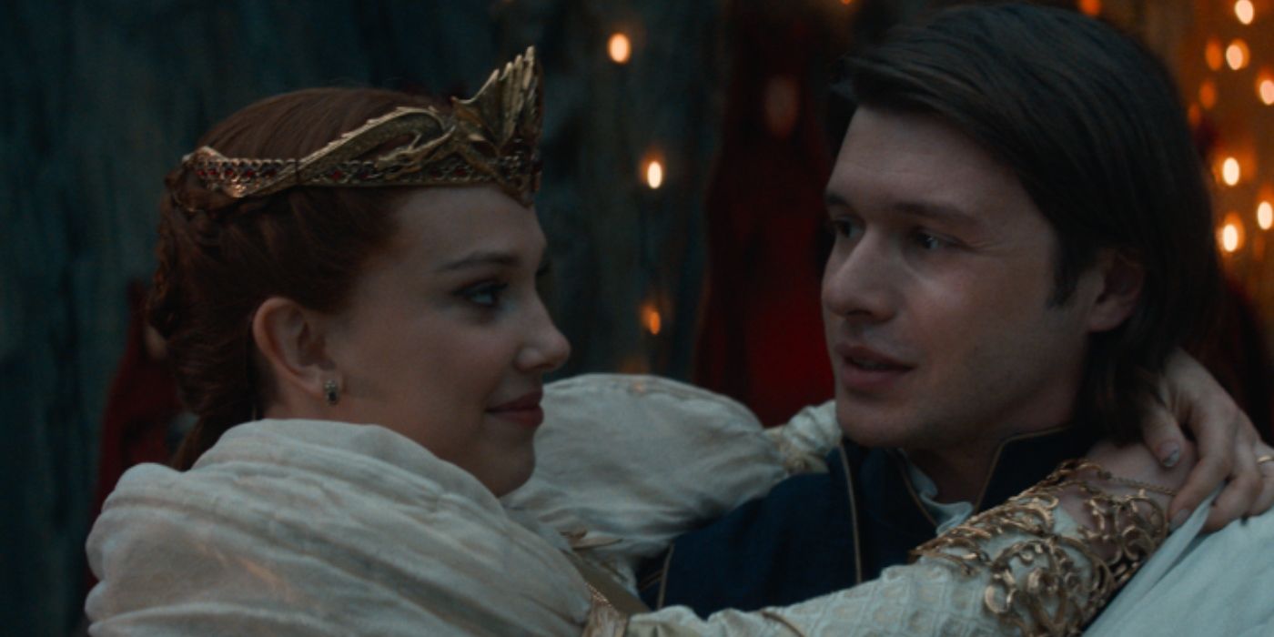 Prince Henry carries Elodie before throwing her into the dragon's cave in Damsel