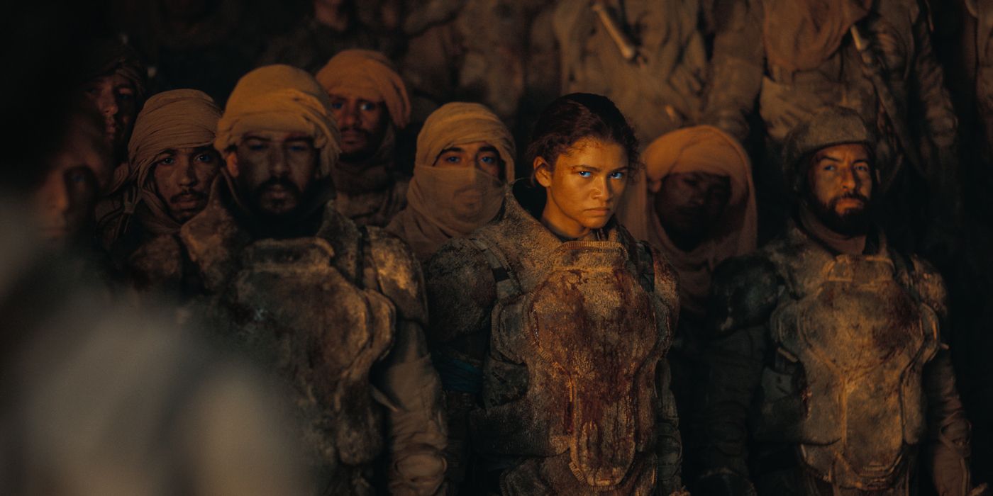 Zendaya as Chani standing next to other Fremen in a cave in Dune: Part Two