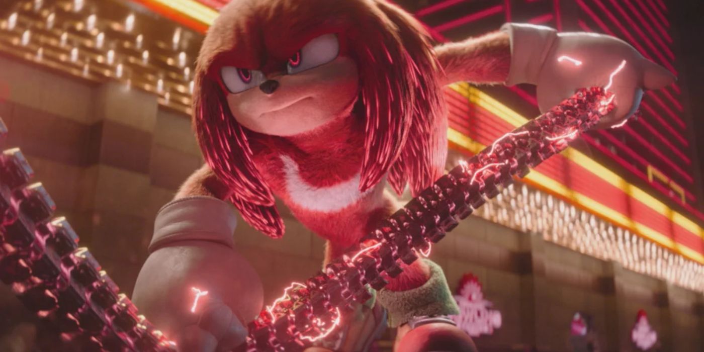 Idris Elba voicing Knuckles holding a large rope powering up in Knuckles
