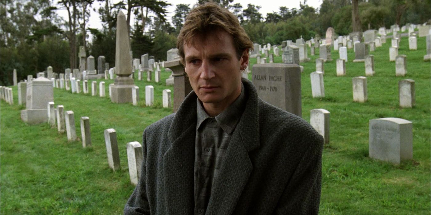 Liam Neeson in a graveyard in The Dead Pool