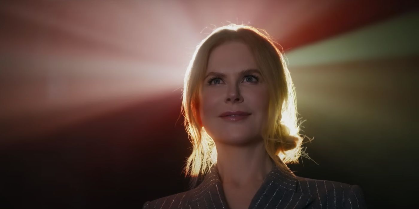 Nicole Kidman smiles in front of a movie projector in AMC Theaters ad