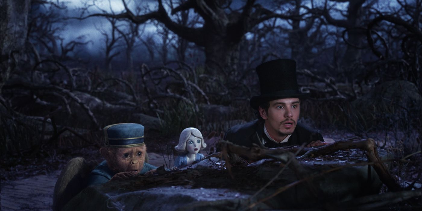 James Franco as Oscar hiding with Finley and China Girl in Oz the Great and Powerful