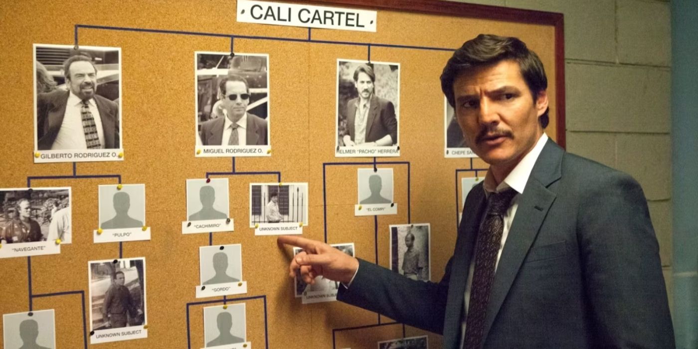 Pedro Pascal as Javier Pena pointing at a cork board in Narcos