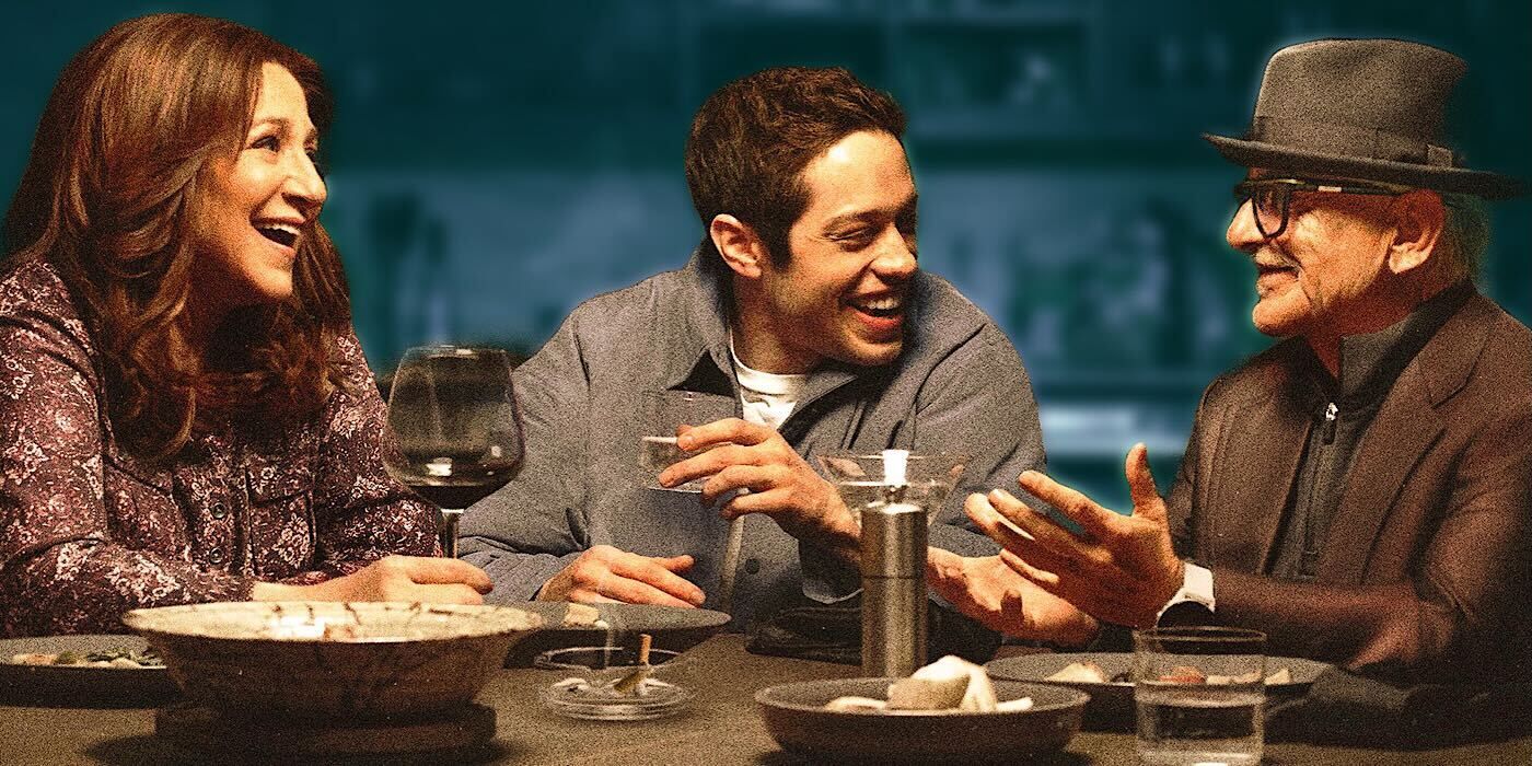 Pete Davidson at a table with on screen family in Bupkis
