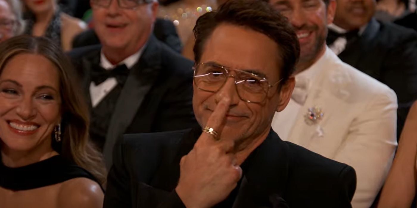 Robert Downey Jr. touching his nose at the Oscars