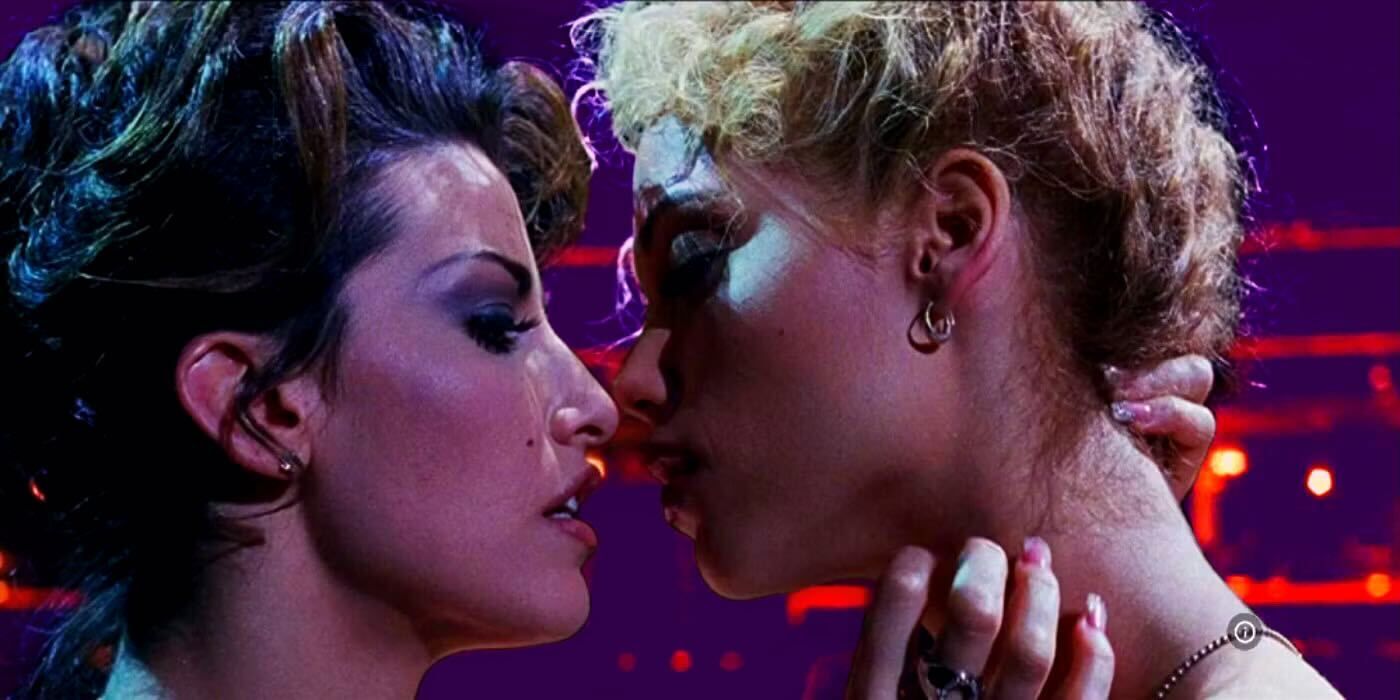 Showgirls two women looking at each other close to kissing