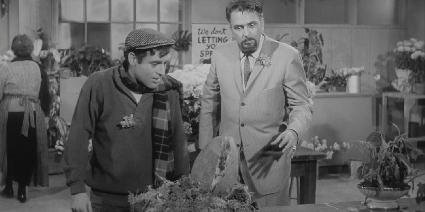 Two Little Shop of Horrors characters stare at a plant