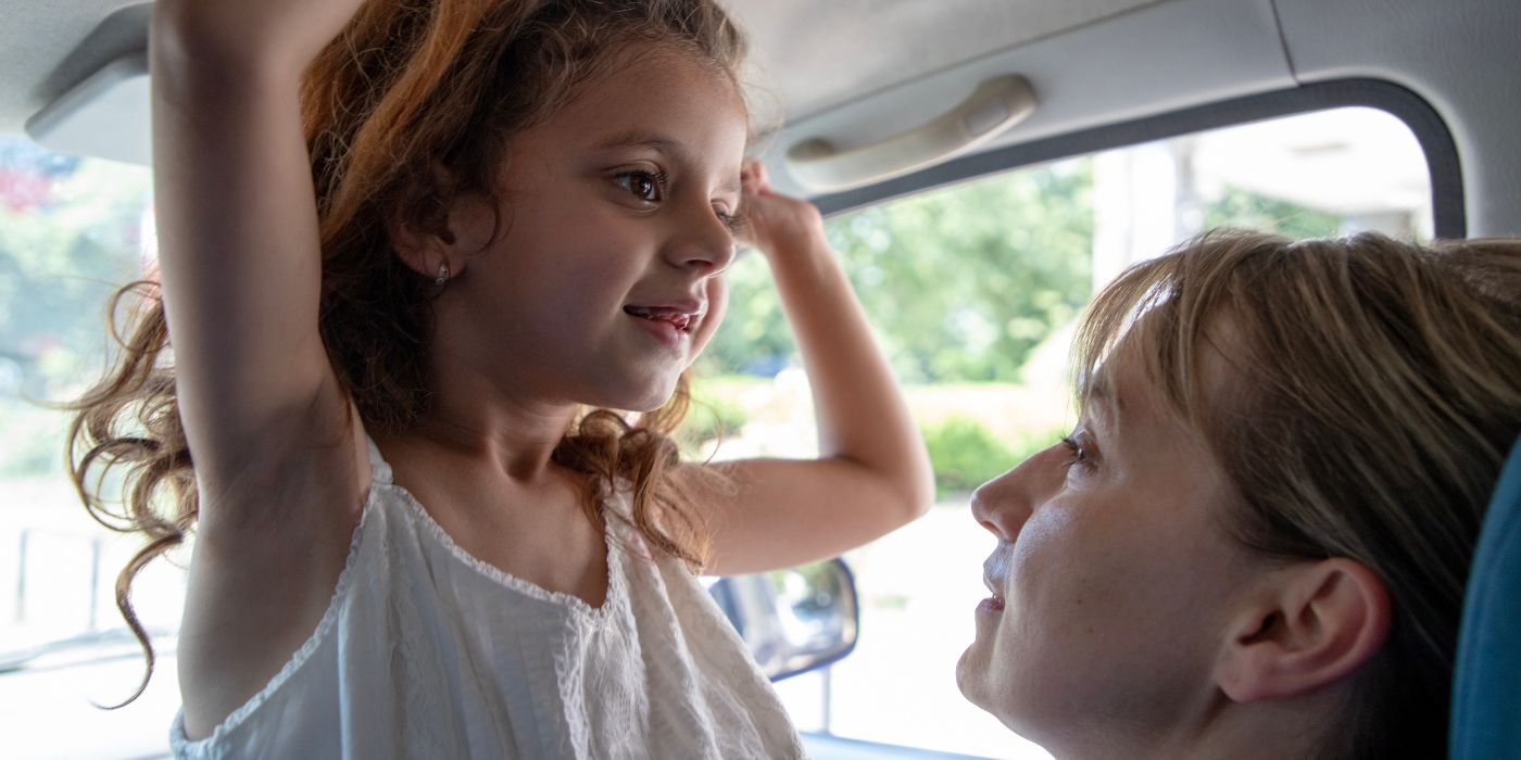 A little girl in a car in Housekeeping for Beginners