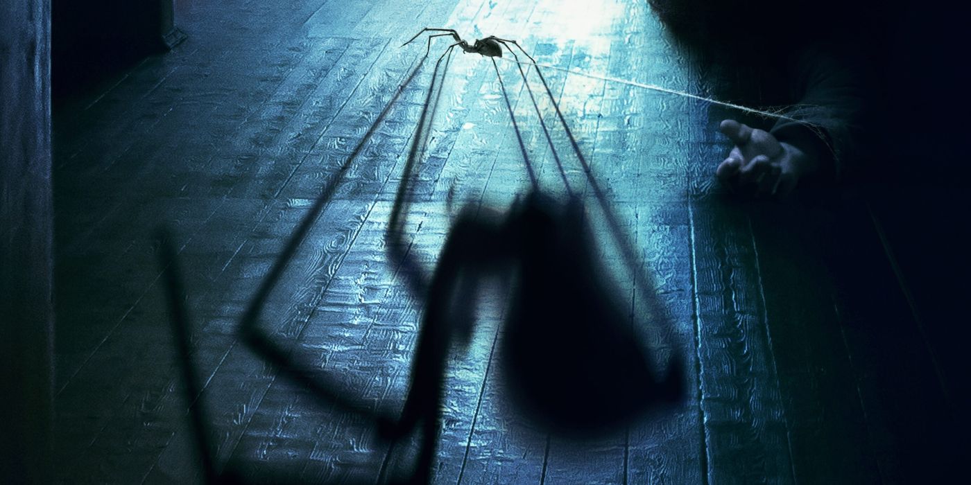 A spider with a web attached to a dead wrist and a big shadow in the movie Sting from Kiah Roache-Turner