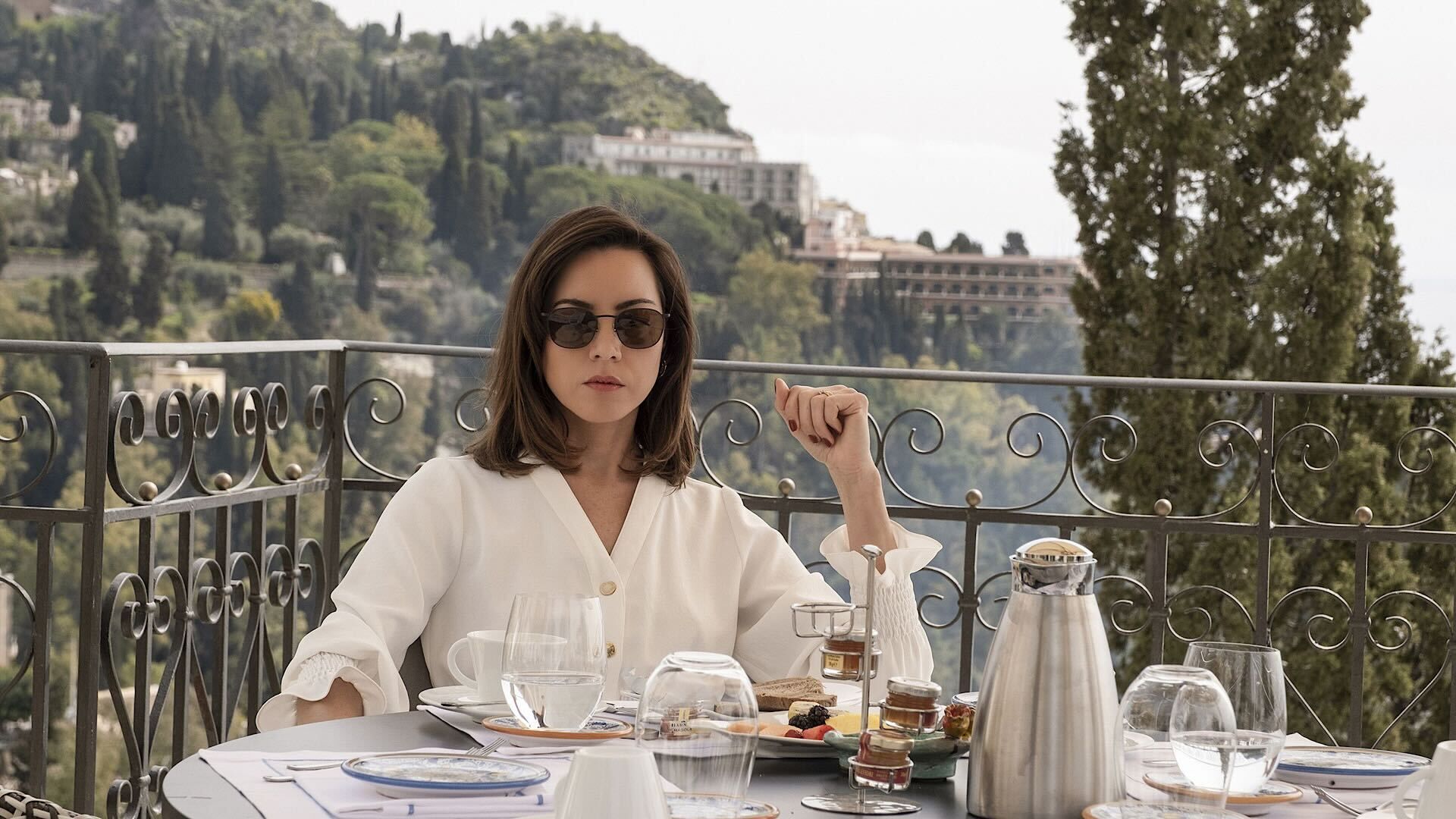 Aubrey Plaza on a balcony in The White Lotus