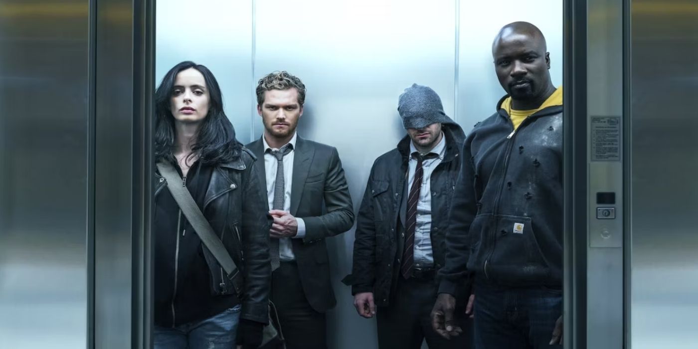 Charlie Cox as Daredevil, Krysten Ritter as Jessica Jones, Mike Colter as Luke Cage, and Finn Jones as Iron Fist standing in an elevator in The Defenders