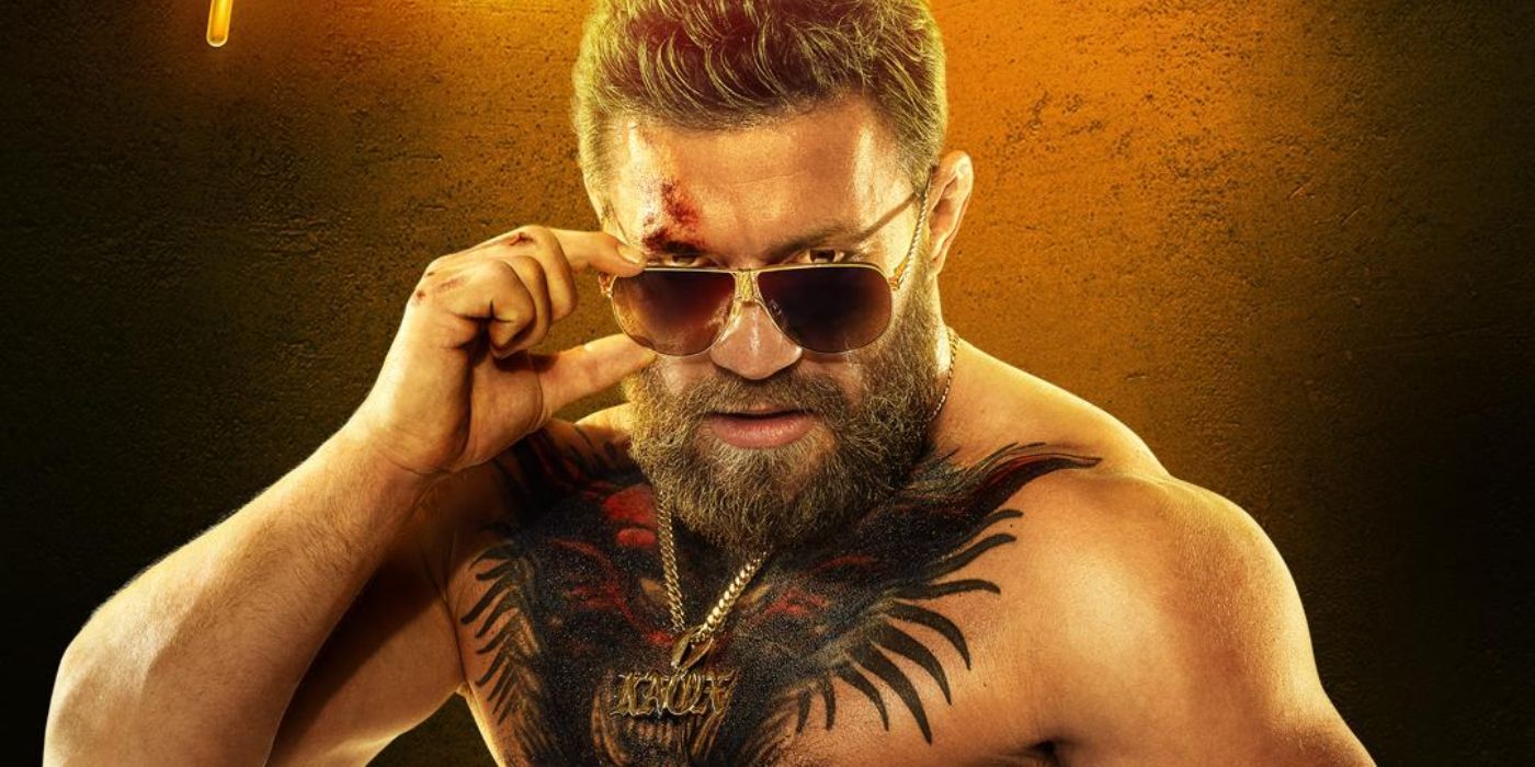 Conor McGregor wearing sunglasses and a gold chain with a tattoo on his chest in Road House