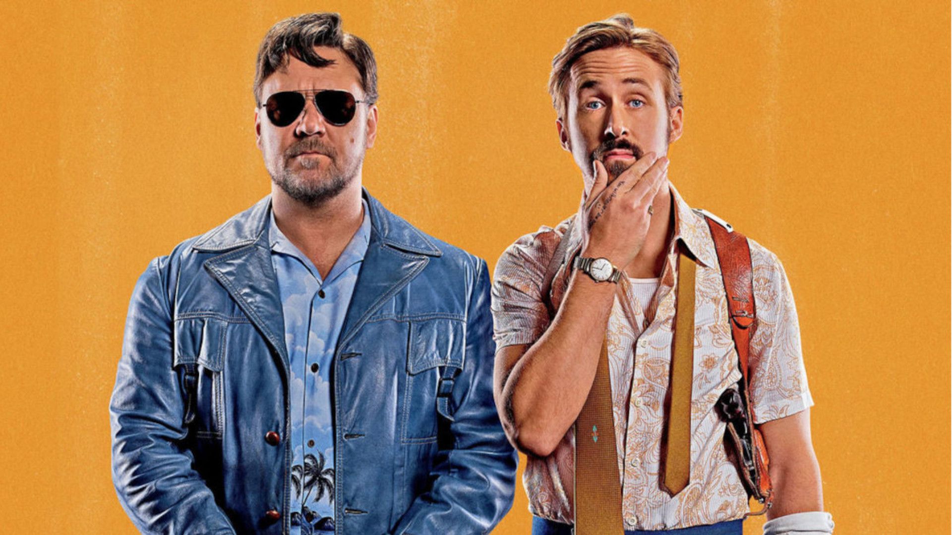 Russell Crowe and Ryan Gosling stand side by side in The Nice Guys