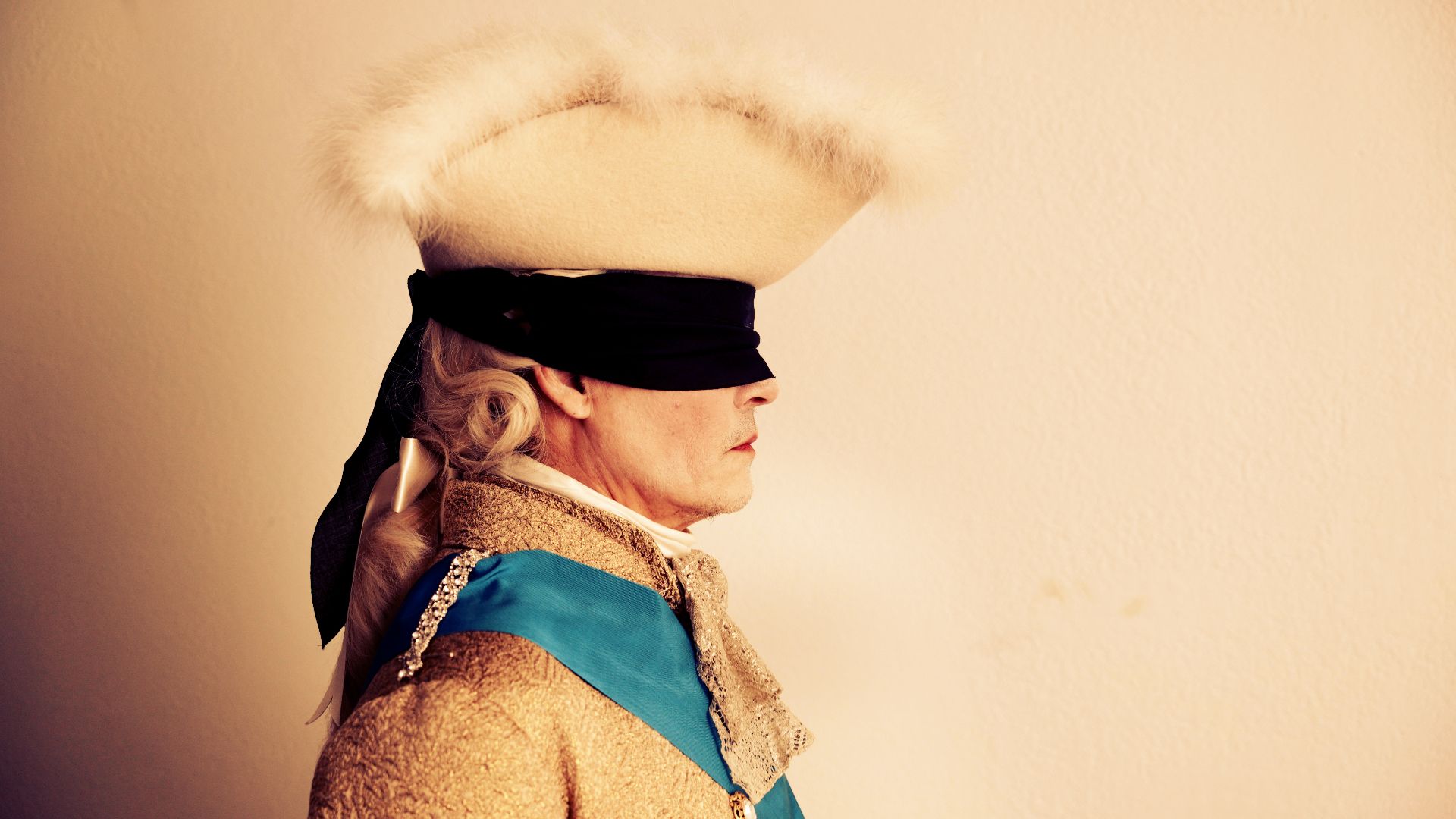 Johnny Depp in a blindfold as King Louis XV in the movie Jeanne du Barry